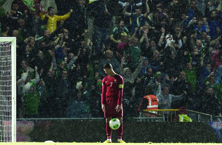 Charles McQuillan/Getty Images. Ronaldo slumps in dejection as Northern Ireland score to go 2-1 up against Portugal at Windsor Park, Belfast. Picture Charles McQuillan. Finalist in the Genesis Imaging Regional Photographer of the Year category at The Picture Editors Guild Awards 2015.